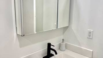 Shower, towels, soap, toilet paper