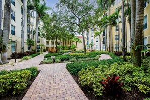 Lush courtyard garden inside The Courtyards at CityPlace - CityPlace Oasis - 2BR Downtown Condo with Pool & Parking (West Palm Beach)