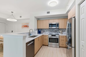 Fully remodeled kitchen with premium Bosch appliances - CityPlace Oasis - 2BR Downtown Condo with Pool & Parking (West Palm Beach)