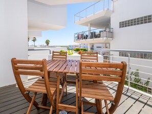 Outdoor dining - 🏖️ Apartment with Sea View at Golden Club – Pools & Beach Access (Cabanas de Tavira)