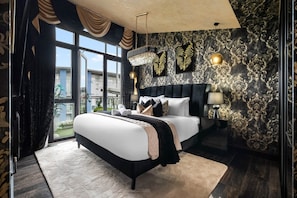 A modern bedroom with a large bed, a chandelier, and a view of the outdoors. - Opulent Penthouse - City Centre - 2Bedrooms - Balconies - 2Secure Parking Spaces (West Midlands)