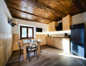 Fridge, microwave, coffee/tea maker, cookware/dishes/utensils