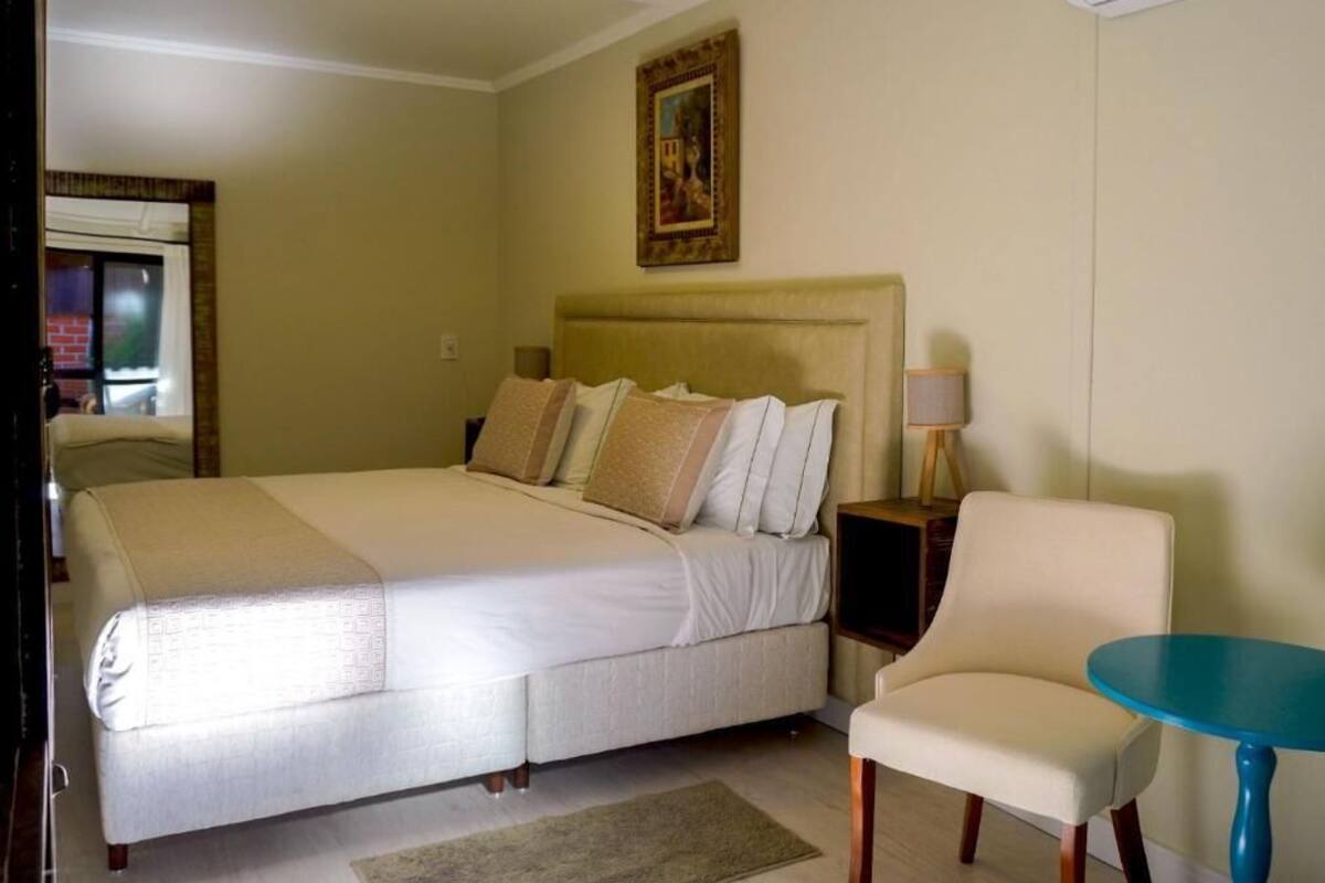 Standard Suite, Balcony, Garden View | In-room safe, iron/ironing board, free WiFi