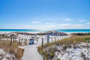 A beach pathway leading to the ocean with signs indicating private property. - House of Blues (Santa Rosa Beach)