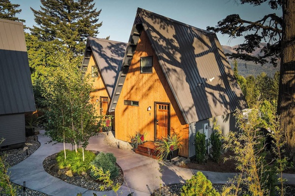 Escape to The Return to Evergreen in Stevenson, WA. Enjoy breathtaking mountain views from this cozy A-frame cabin, complete with a private soaking tub perfect for unwinding in nature.
