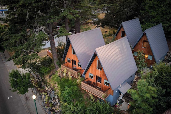 The Return to River invites you to imagine your mountain escape — cozy cabins nestled among the trees, each offering a warm, welcoming retreat where your getaway begins the moment you reserve.