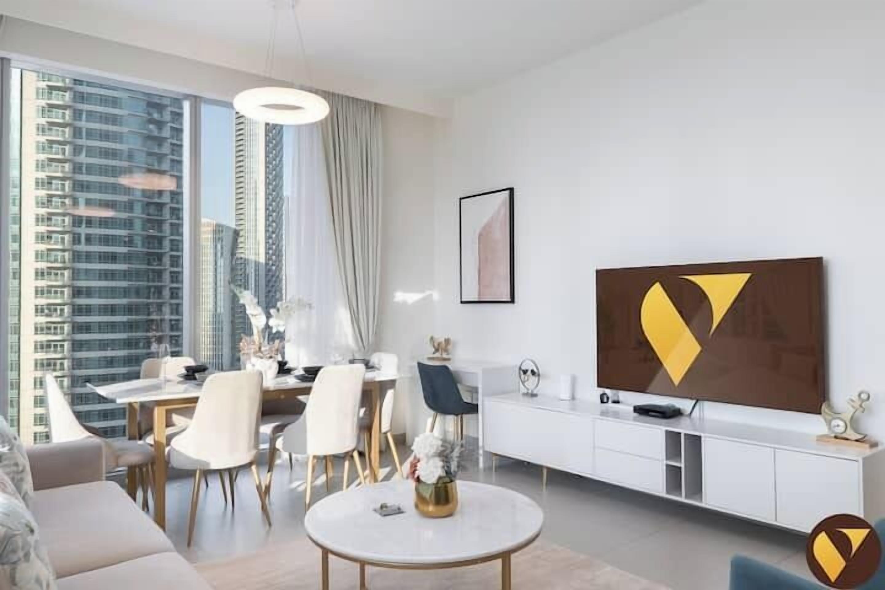 Luxury Apartment, Balcony, City View | Living area | 65-inch Smart TV with cable channels, foosball