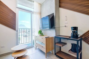 Junior Suite, City View | Living area | Smart TV