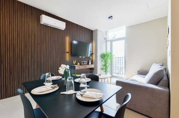 Suite, City View | Living area | Smart TV