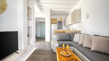 Deluxe Apartment, Patio, Pool View | Living area | TV