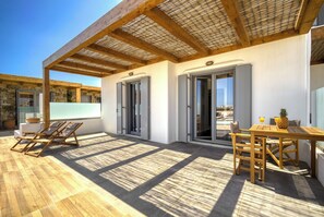 Deluxe Apartment, Patio, Pool View | Outdoor dining - KK Mykonos Village (Mykonos)