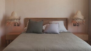 A bedroom with a large bed, two nightstands, and two wall-mounted lamps. - Tulum 2BR Penthouse Pool Rooftop gym B5 (Tulum)