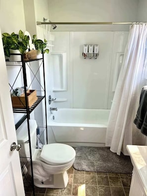 Shower, hair dryer, towels, shampoo