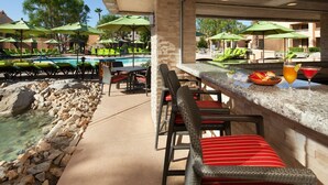 A poolside bar area with lounge chairs and a pool. - Westin Mission Hills Resort Villas – 1BR Premium – March 7–14 2026 – Owner Week (Rancho Mirage)