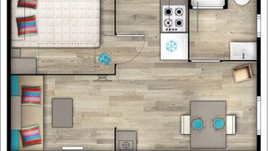 A compact studio apartment with a kitchenette, a single bed, a small dining table, and a bathroom. - Carva - Confort 1 TV - 2p (La Guérinière)
