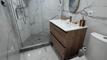 Shower, hair dryer, towels, soap