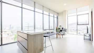 Suite, City View | Living area | 42-inch Smart TV with digital channels, streaming services