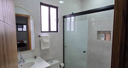 New centrally located apartment with shared balcony.