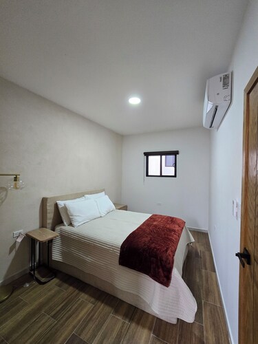 New centrally located apartment with shared balcony.