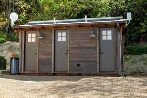 Unclassified image, 4 of 7, button - North Cape Dome - Forest View - Sleeps 4 - Our North Cape, Forest view Dome contains 1 King bed, 1 Twin Day Bed, 1 Trundle sleeps 4. Each has access to a modern luxury SHARED bathhouses and in dome electric fireplace, heat, fans, wet bar, work desk, (Cloverdale)