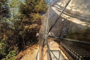 Unclassified image, 3 of 7, button - North Cape Dome - Forest View - Sleeps 4 - Our North Cape, Forest view Dome contains 1 King bed, 1 Twin Day Bed, 1 Trundle sleeps 4. Each has access to a modern luxury SHARED bathhouses and in dome electric fireplace, heat, fans, wet bar, work desk, (Cloverdale)