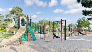 A playground with slides and climbing structures. - 2 bdrm with full kitchen (Williamsburg)