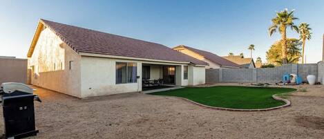 Private backyard space with BBQ grill