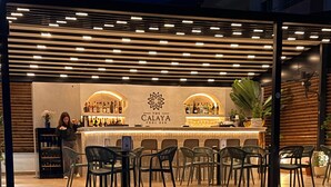 A pool area with a bar and seating. - Le Caprice - Sun & Sea (Sarandë)