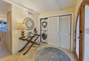 A hotel lobby with a washing machine, a lamp, a star-shaped decoration, and a wooden table. - New High End Rental At Cowpet Bay! Amazing Views/Breezes! (East End)