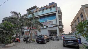 A multi-story building with signs for "Balaji Residency" and "Global Griddle." - Hotel Balaji Residency Dombivli (Kalyan)