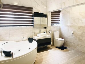 Shower, jetted tub, towels, soap