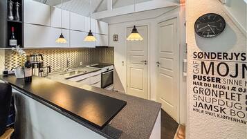 Fridge, stovetop, dishwasher, coffee/tea maker