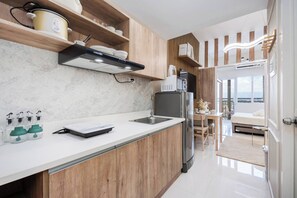 Studio, 1 Bedroom, Accessible | Interior - Elegant Wood-accent Studio With Balcony (Lapu-Lapu)