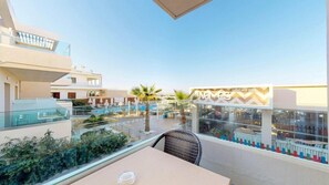 A rooftop terrace with a pool, dining area, and a restaurant named 'Waves'. - Marika Hotel Chania (Platanias)