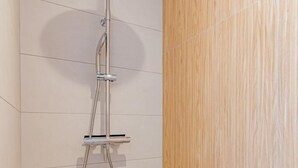 A shower with a handheld showerhead and a wall-mounted control panel. - Cosy Bresse - SAINT VINCENT EN BRESSE (SAINT VINCENT EN BRESSE)