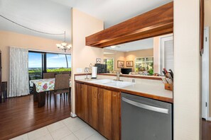 Fridge, microwave, oven, stovetop - Experience ocean views at KK2402 Hale Lokahi, a 2-bedroom condo in Keauhou. (Kailua Kona)