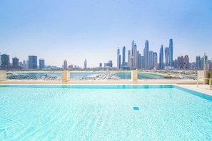 Outdoor pool - SettlerHomes, Emaar Beachfront Haven with Sea View (Dubai)