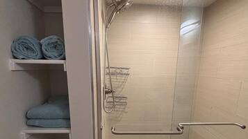 Shower, hair dryer, towels, soap