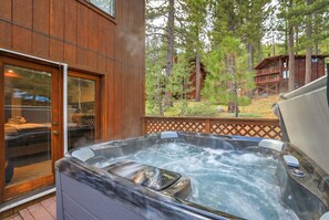 A hot tub outside a wooden cabin with a view of trees. - Palisades! Spacious Living, Views & Family Fun (Tahoe City)