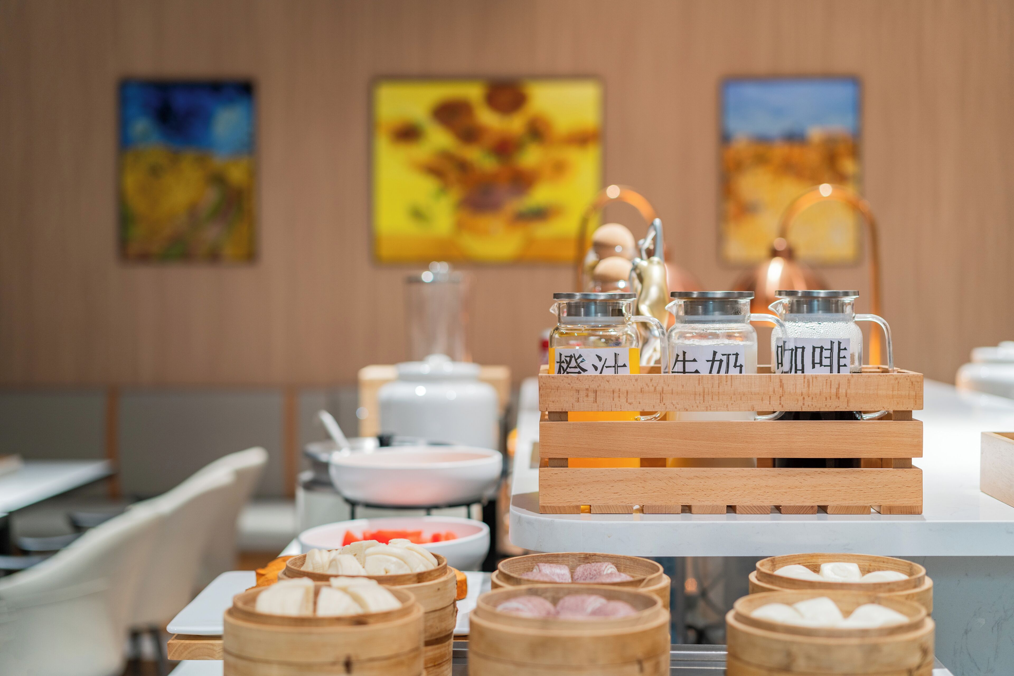 A buffet setup with various food items and condiments.