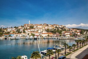 A coastal town with a marina, historic buildings, and a prominent tower. - Holiday apartment with air conditioning and Wi-Fi (Poreč)