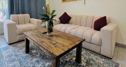 Spacious 2BR in Lively Neighborhood • Near Airport • Family Ready