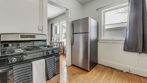 A kitchen with a gas stove, oven, and stainless steel refrigerator. - 8 Mi to Micron Technology! Walkable Phoenix Gem (Phoenix)