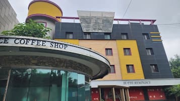 A building with a coffee shop and a hotel.