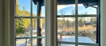 Cabin in magnificent landscape and hot tub inside