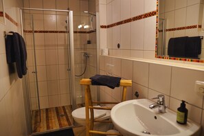 Shower, hair dryer, towels, soap