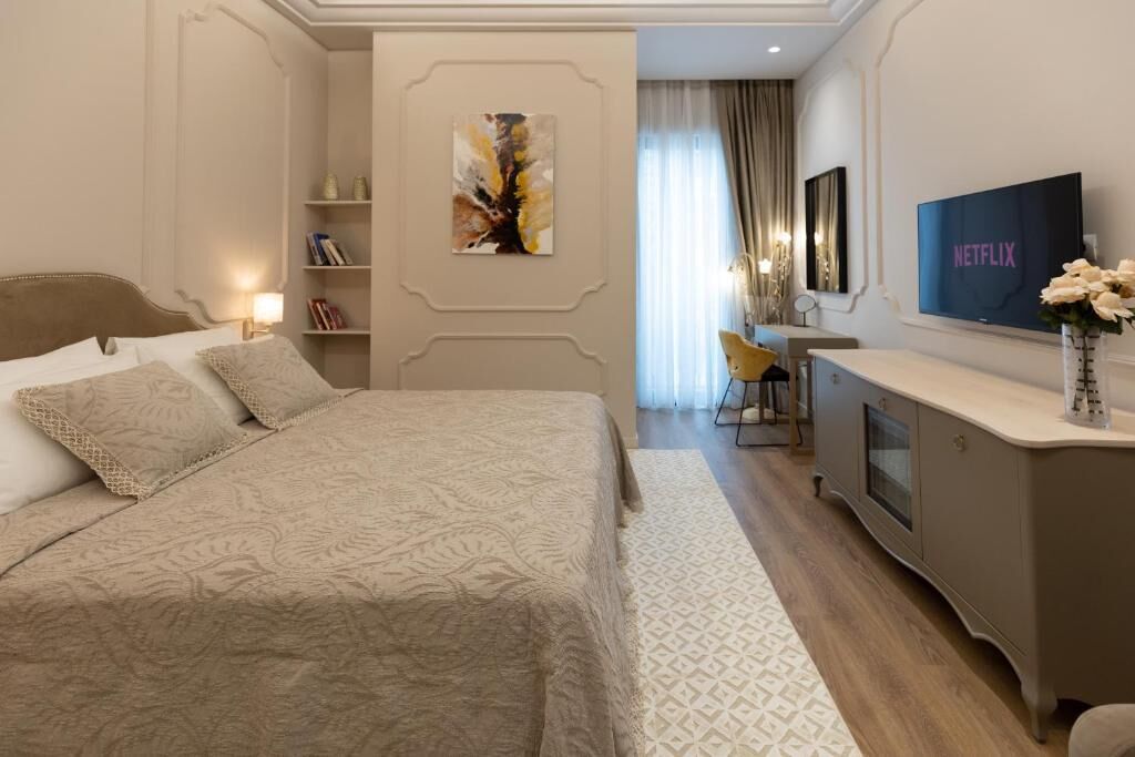 Deluxe Double Room, Balcony, City View | In-room safe, desk, soundproofing, iron/ironing board