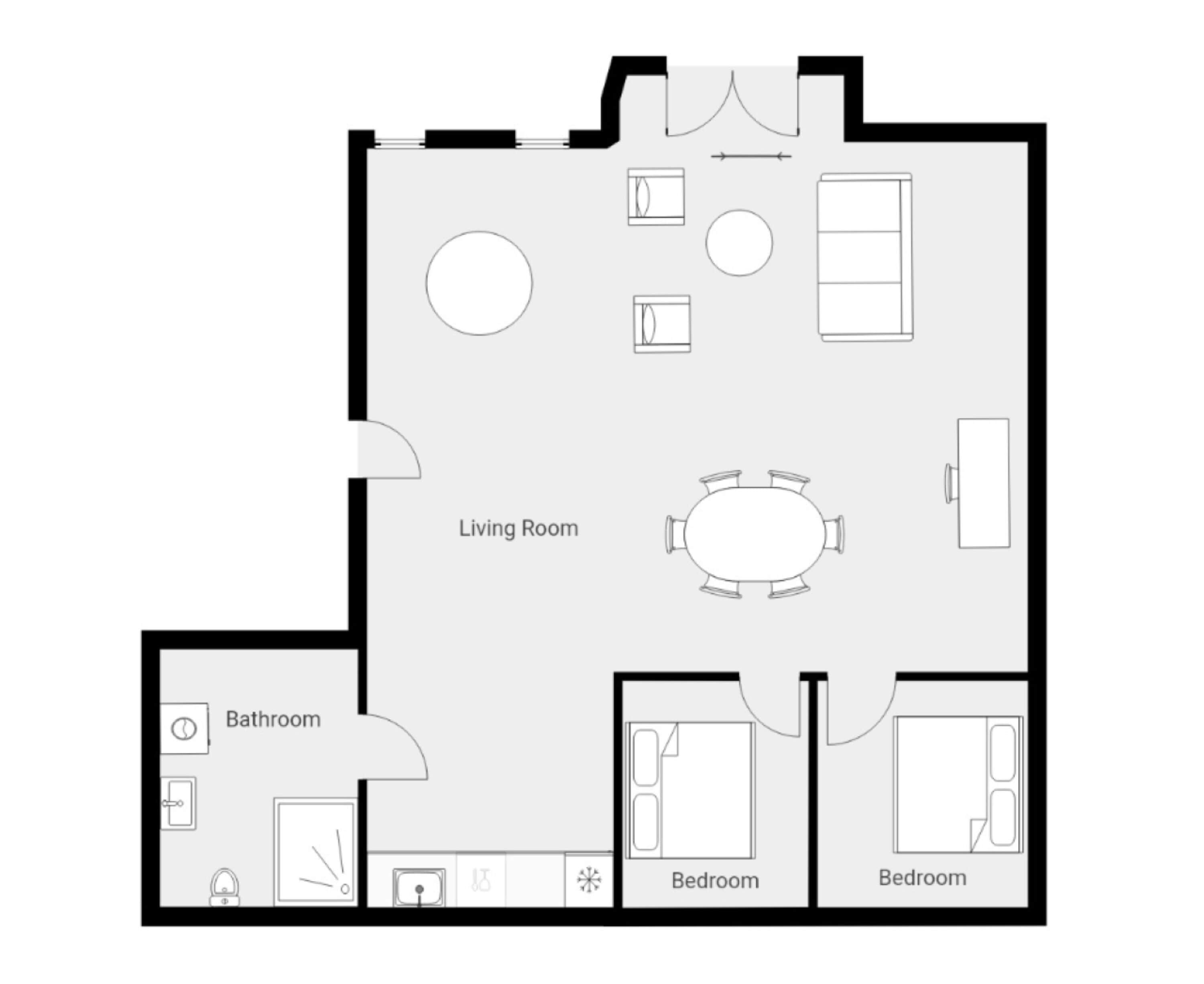 A floor plan with a living room, two bedrooms, a bathroom, and a dining area.