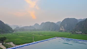 Outdoor pool, open 8:00 AM to 6:00 PM, pool loungers