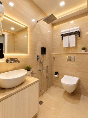 A modern bathroom with a large sink, a bidet, a shower, and a toilet. - The Aura Hotel (Faizabad)